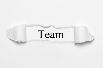 Team on white torn paper