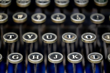 Close up of alphabet keys on a vintage manual typewriter.
