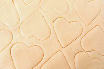 Dough for cookies. A mold for cutting cookies in the form of heart. St. Valentine's Day. Top view