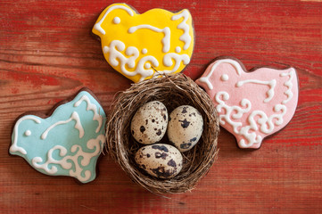 Colorful easter cookies on a wooden background