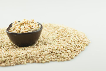 Sprouts of green buckwheat in a bowl. Macro shot. Raw buckwheat. Useful food from buckwheat sprouts for vegetarian food.