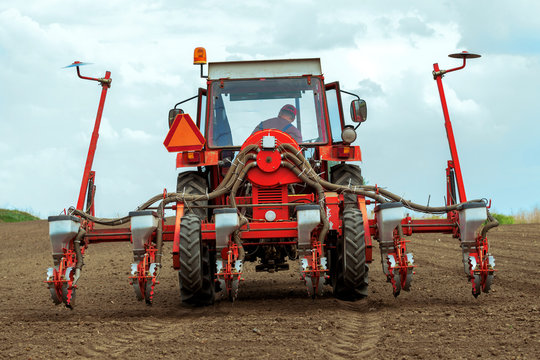 Tractor With Mounted Crop Seeder