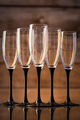 champagne glasses on a black leg