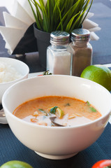 Seafood Thai soup served on white bowl, Thai food cuisine calling Tom Yum Kung.