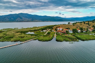 Fototapeta premium aerial view of island of Agios Achilios in lake Small Prespes, Greece