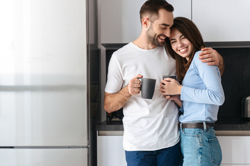 Beautiful young couple drinking coffee