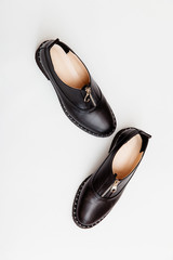 Stylish female spring or autumn shoes in black color. Beauty and fashion concept. Flat lay, top view 