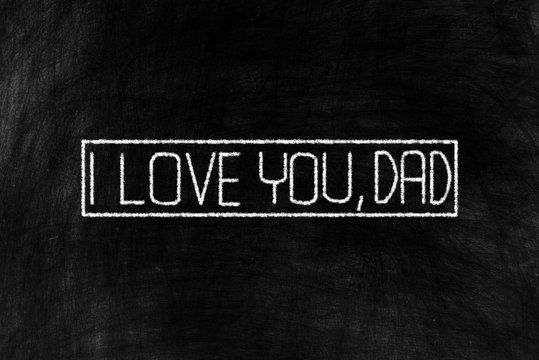I Love You, Dad in Chalk Writing on Old Grunge Chalkboard Background, Suitable for Happy Fathers Day.