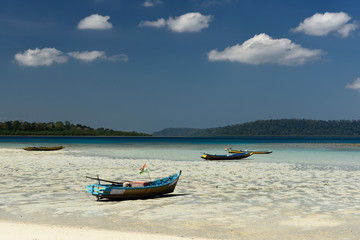Fototapeta na wymiar Fishermen boats on the Pristine beach, Havelock Island of the Andaman and Nicobar Islands, India