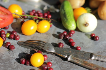 kerosene lamp, lemons and tomatoes, forks and knives