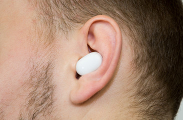 Wireless earpiece in guy's ear