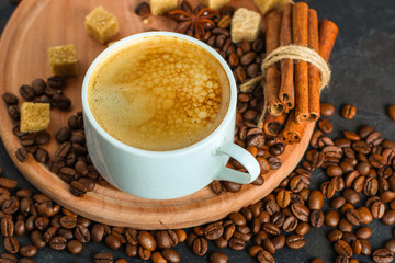 coffee fresh and hot in a white cup, aroma. serving of beverage (coffee grain). food. top view. copy space