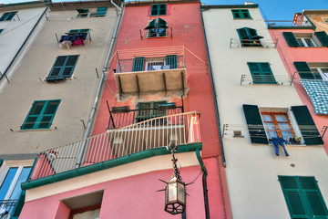 colored facade of houses on the seafront of Porto Venere in Italy bottom view in perspective