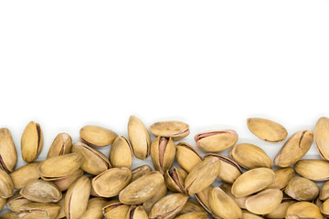 Roasted and salted pistachios in shell on white background