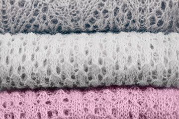 Stylish knitted pastel colored sweaters and one in lilac trendy color of spring and summer 2019...