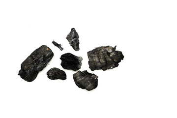 Top view of black burnt firewood isolated on white