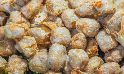 Deep Fried Crab Meat Rolls or Hoi Jo. Traditional Thailand and Chinese food for appetizer. Asian Traditional food pattern texture background.