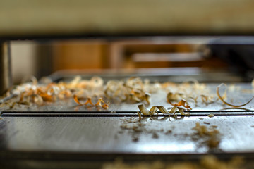 Macro photography of wood chips on a carpenter planer. Captured in a workshop near the colonial town of Villa de Leyva, in the Andean mountains of central Colombia.