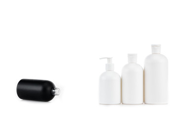 Black and white cosmetic bottles isolated on white