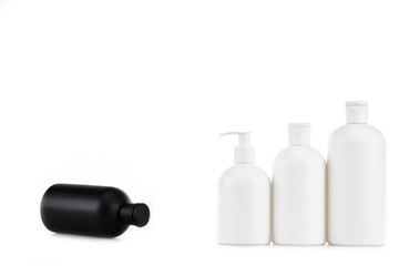 Black and white cosmetic bottles isolated on white