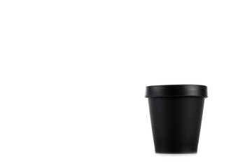Black plastic cup isolated on white with copy space