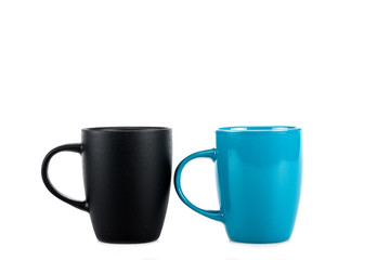 Big black and blue ceramic cups isolated on white