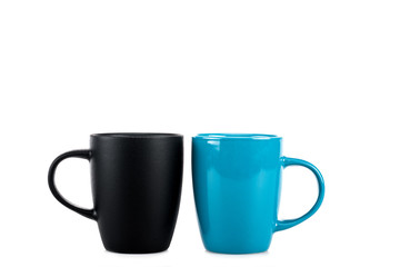 Big black and blue ceramic cups isolated on white