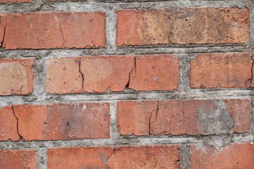 Old brick wall with cracks and scratches , background, texture	