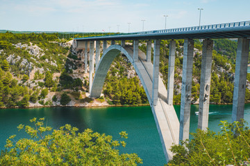 Fototapeta premium highway bridge cross river with blue water. summer time