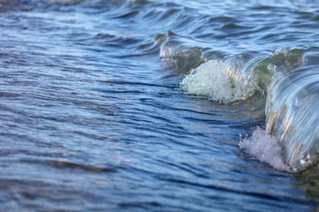 Waves on the seashore as an abstract background