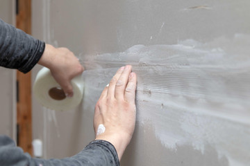 Tape for plaster on the wall. Repair in the house