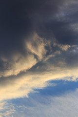 Clouds after rain before sunset as a background