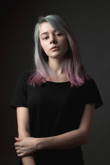 Studio portrait of the beautiful young woman with dyed hair