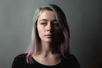 Portrait of the beautiful girl with dyed hair. Low key