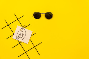 items for rest in hot countries on yellow background. copy space for text in travel advertising. travel time. Items for summer vacation. summer flat lay. top view. sunglasses