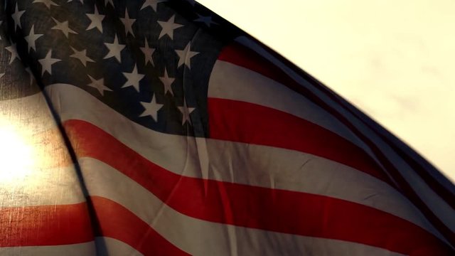 The concept, Labor Day: Flag of the United States against the sky and light of the sunset footage slow motion