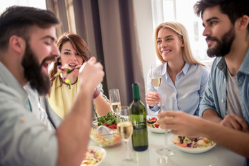Friends having lunch together at home