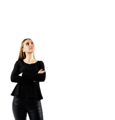 Obraz premium Young woman in black on bright background.