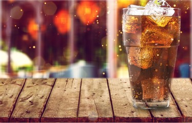 Glass of cola with ice cubes isolated on white background