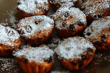 Delicious sweet homemade freshly baked cupcakes, Cupcakes with selective focus, on a gray background