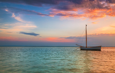 Lonely boat on the Baltic Sea at sunset