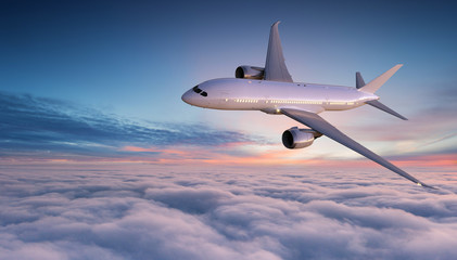 Fototapeta na wymiar Commercial airplane jetliner flying above dramatic clouds.