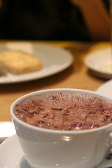 Glass of Chocolate Milkshake with frothy bubbles