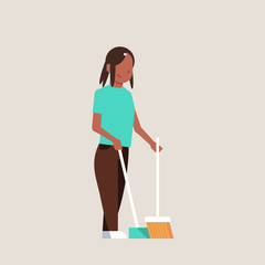 housewife sweeping floor with broom and scoop african american girl doing housework house cleaning concept female cartoon character full length flat gray background
