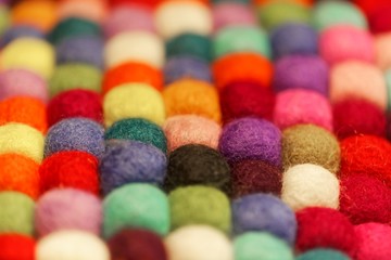 Fototapeta na wymiar Different colored balls of wool