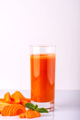 Delicious carrot cocktail on the white background.