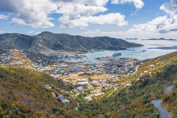Fototapeta na wymiar Scenic aerial view of capital of British Virgin Islands Tortola. Beautiful sunny summer landscape of little tropical islands in Caribbean sea. Look of port of small town on green hills.
