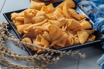 crunchy corn cones snack on wooden bowl