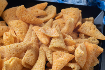 crunchy corn cones snack on wooden bowl