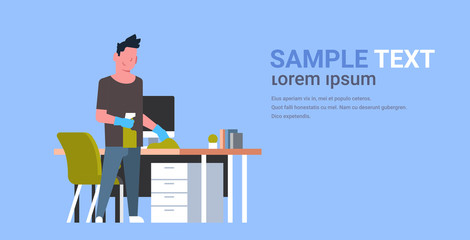 man cleaning computer table with duster guy wiping workplace desk housework concept male cartoon character full length flat horizontal copy space